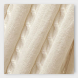 Komplet z visokim ovratnikom, hlačami in brezrokavnikom